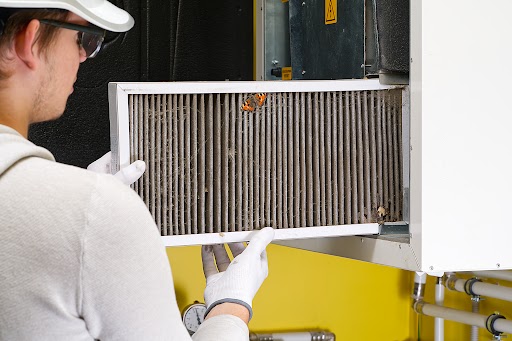 hvac filter replacing. Replacing the filter in the central ventilation system, furnace. Replacing Dirty Air filter for home central air conditioning system. Change filter in rotary heat exchanger recuperator.